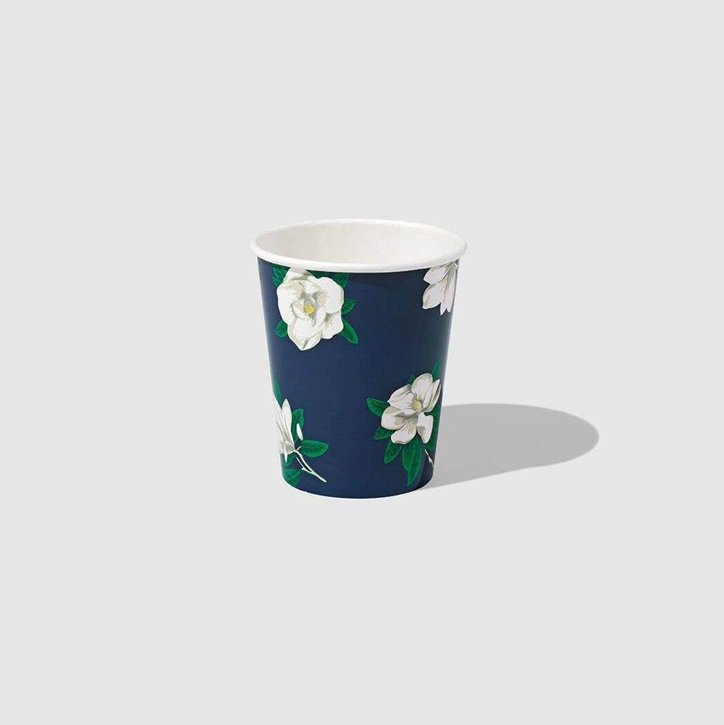 Blue paper cup with white magnolia flowers floral