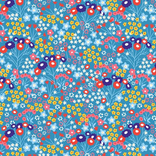Pink yellow purple and blue flowers on blue wrapping paper