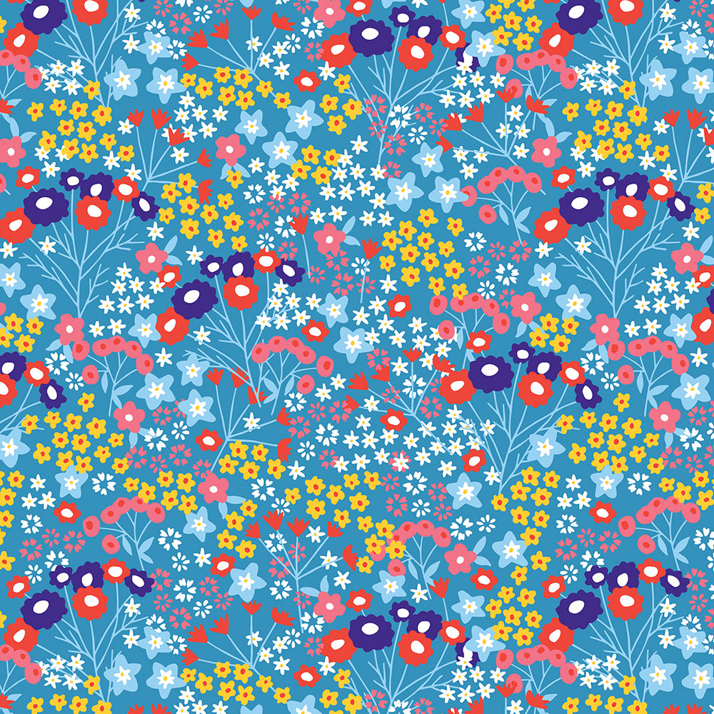 Pink yellow purple and blue flowers on blue wrapping paper