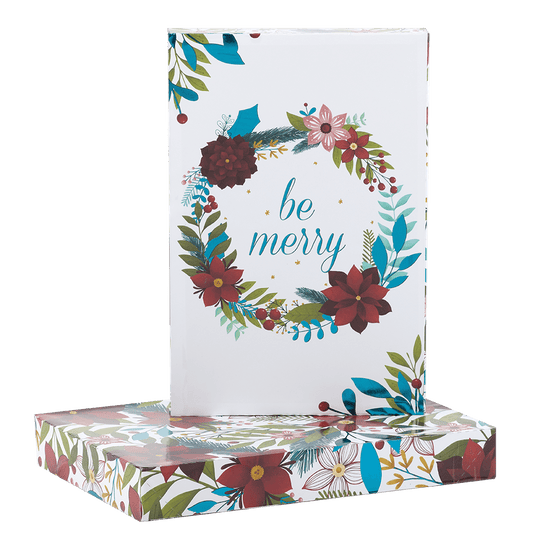 Be Merry surrounded by winter wreath on white apparel shirt box