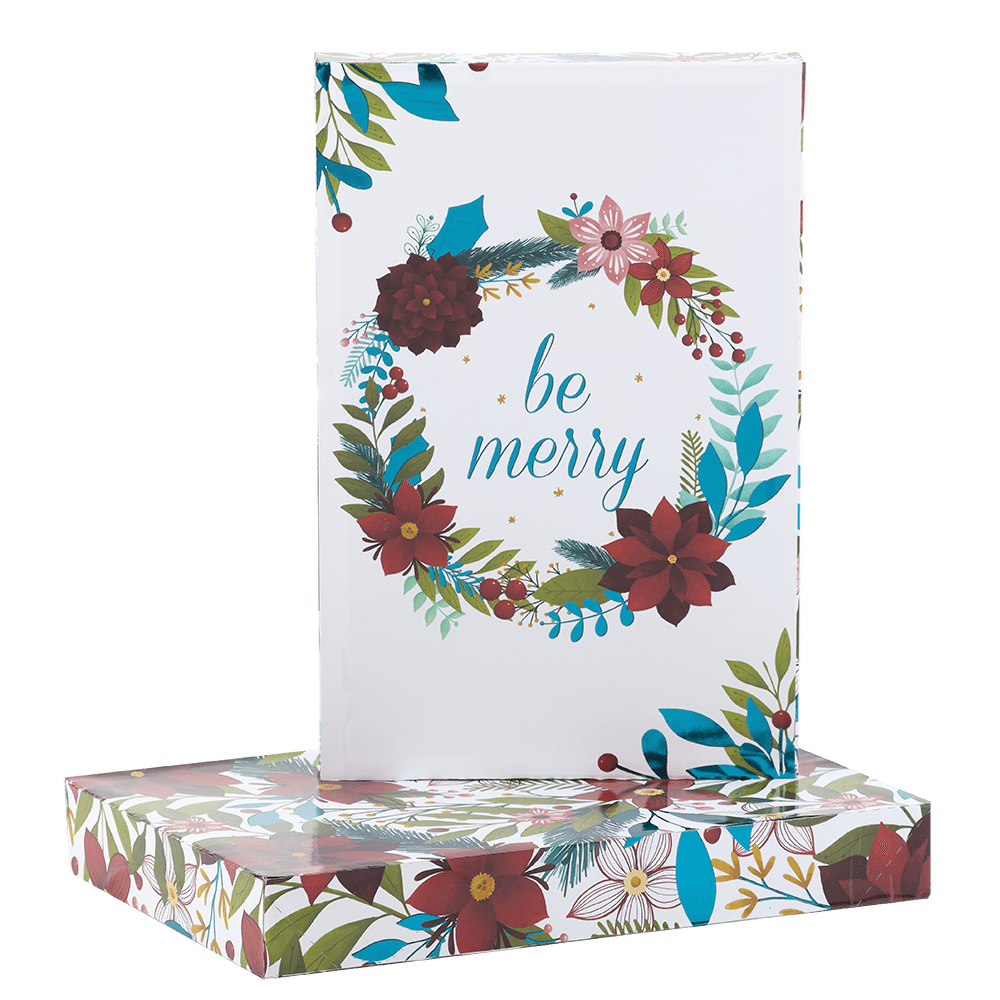 Be Merry surrounded by winter wreath on white apparel shirt box
