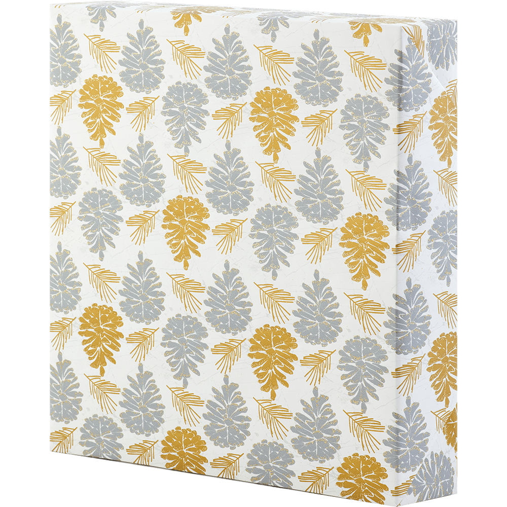 gold and silver glittered pine cones on white wrapping paper 