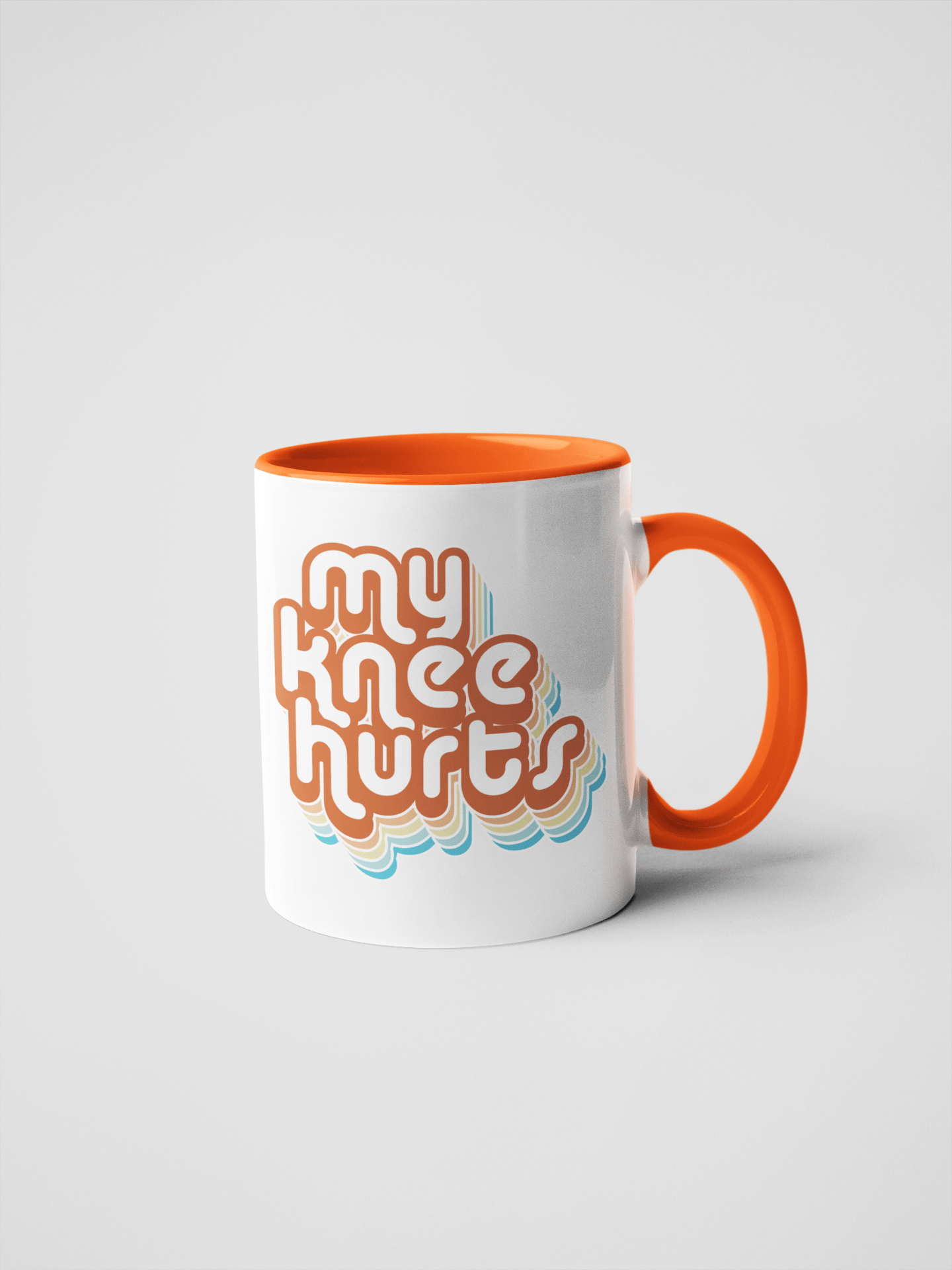My Knee Hurts Ceramic Coffee Mug: 15 oz. / White/Orange